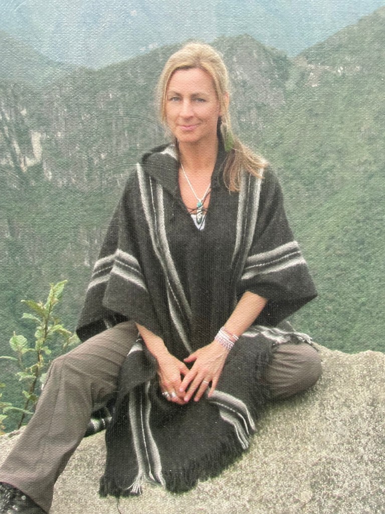 Kathy sitting on rock